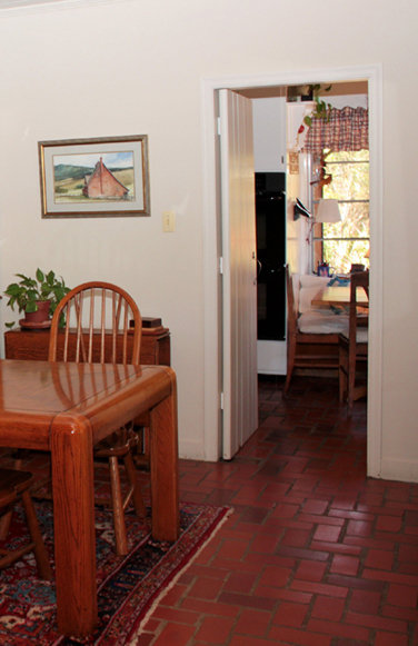 Tile flooring and vertical plank doors in a 1945 Adobe House in Martinez CA